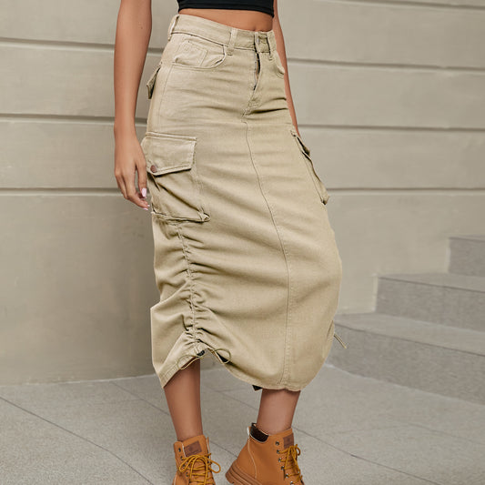 Model left facing view wearing drawstring ruched skirt in the color sand