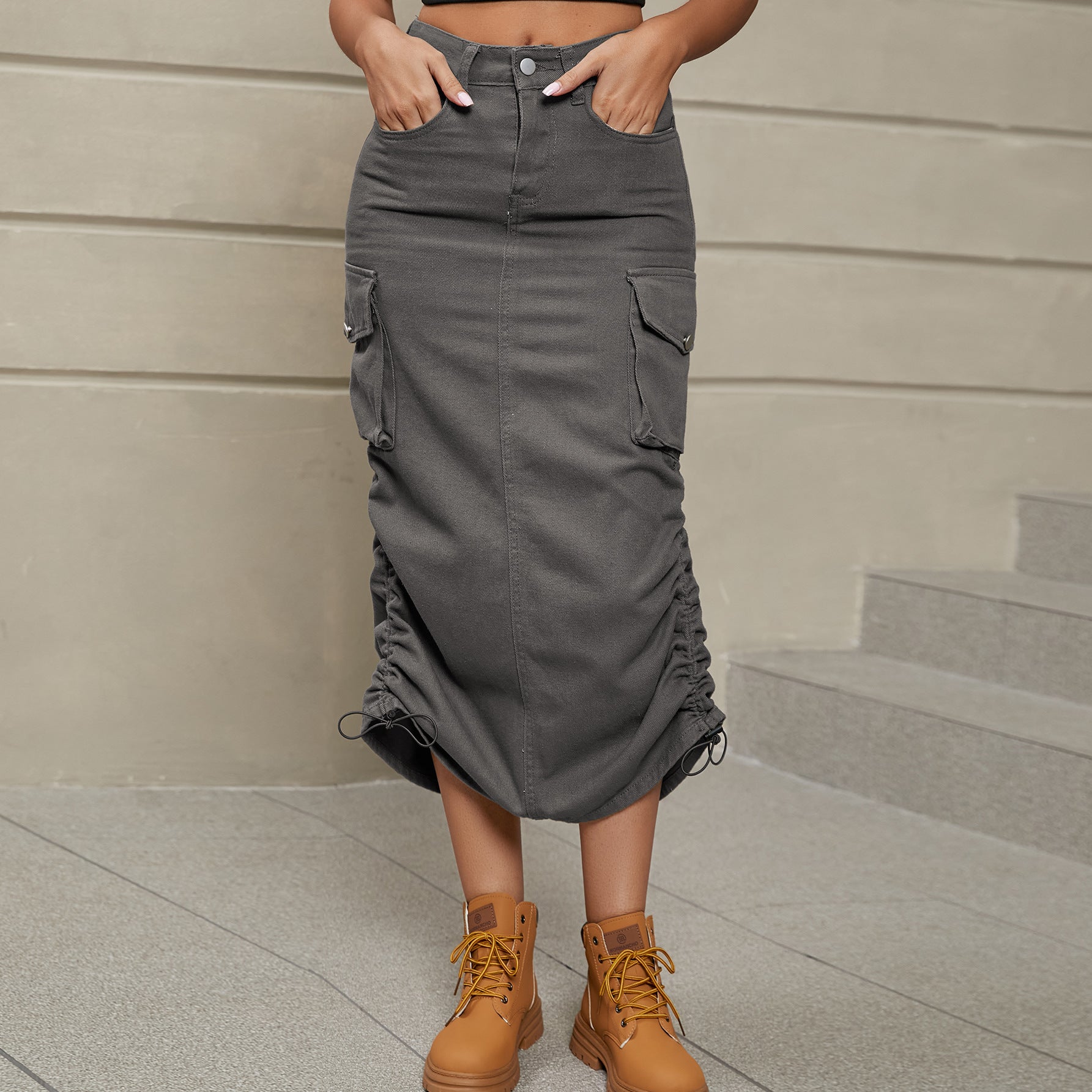Front facing view of model wearing drawstring ruched skirt in the color mid gray.