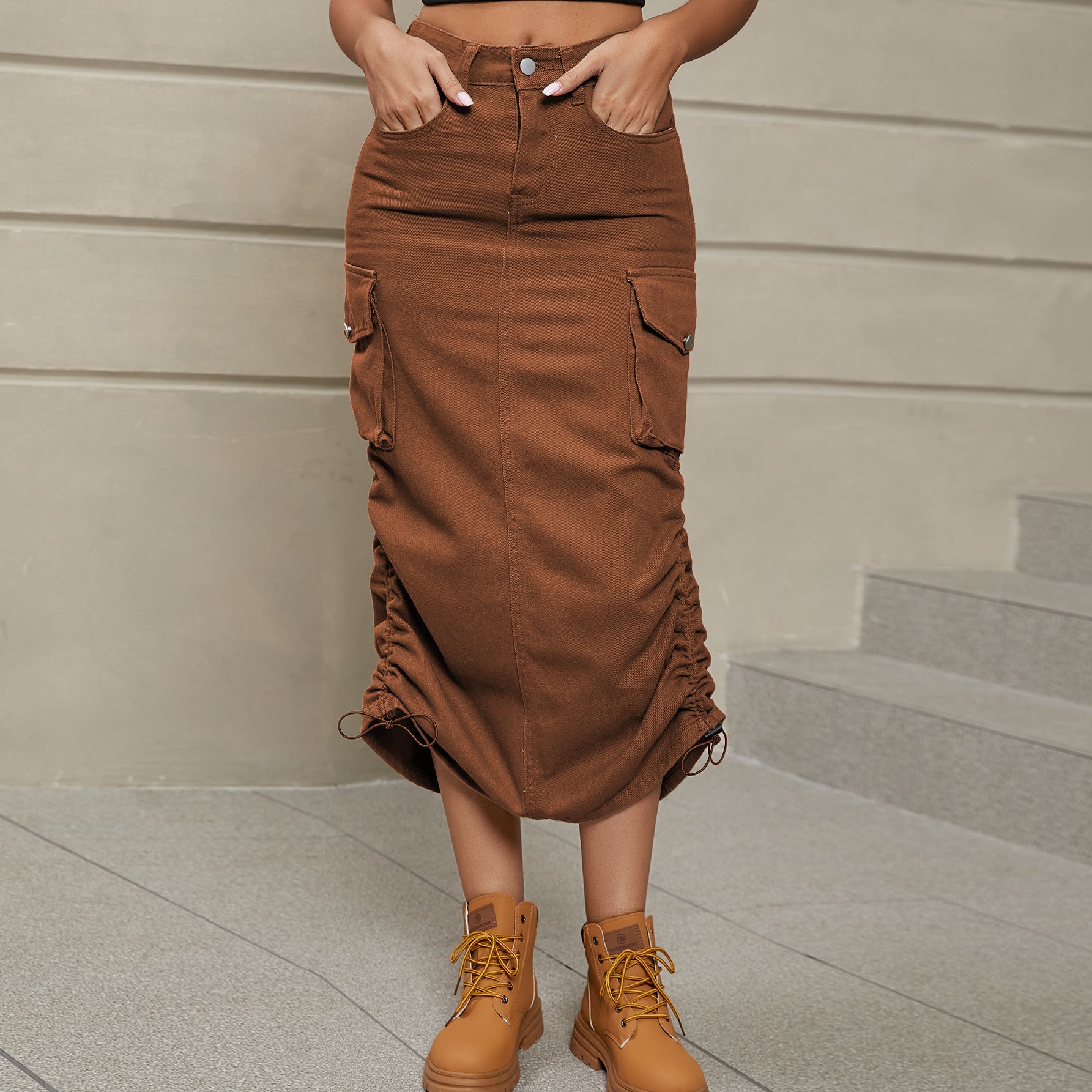 Front facing view of model wearing drawstring ruched skirt in the color chestnut.
