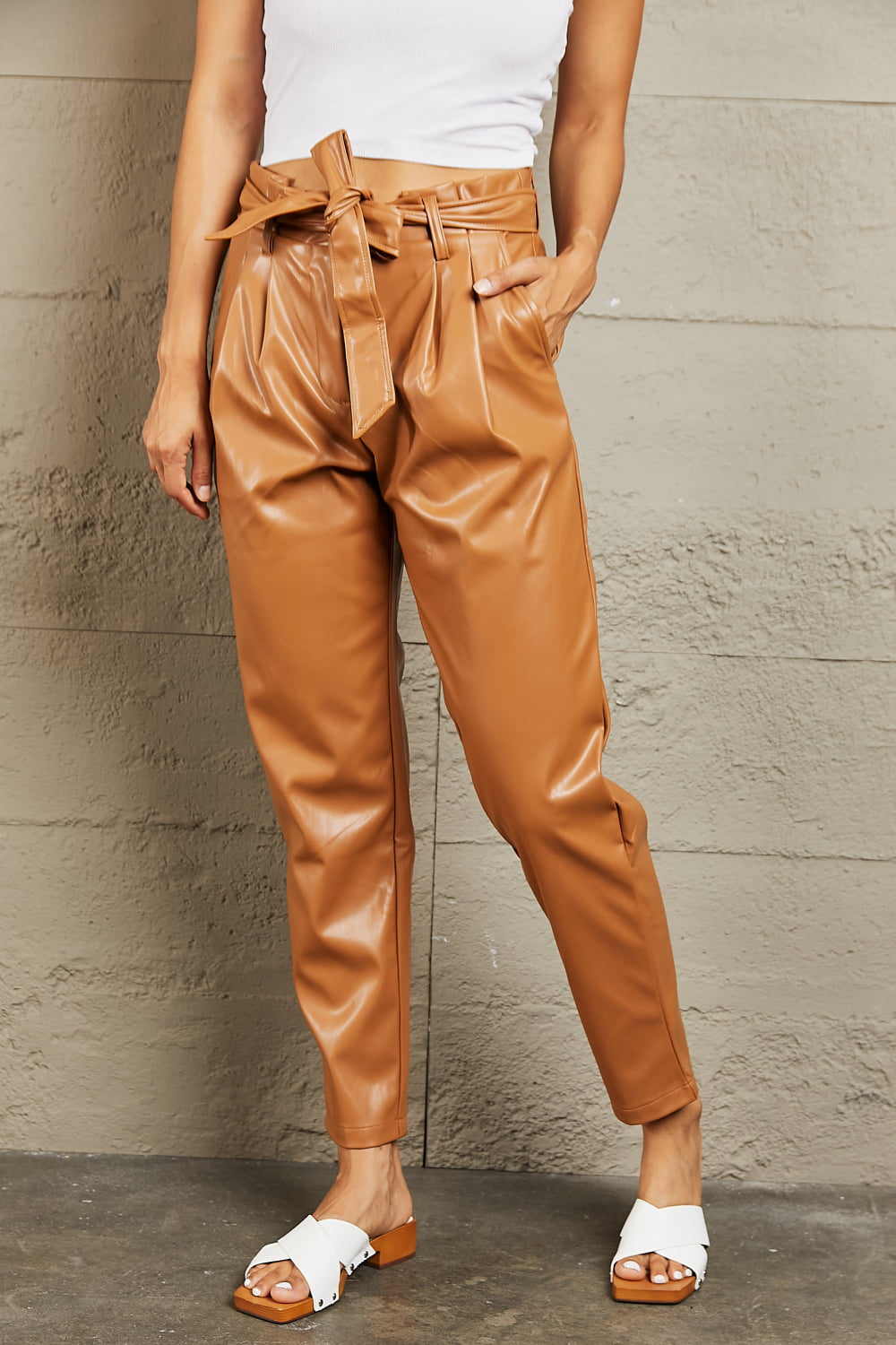 Front view of model wearing Heyson Faux Leather Paperbag Pants