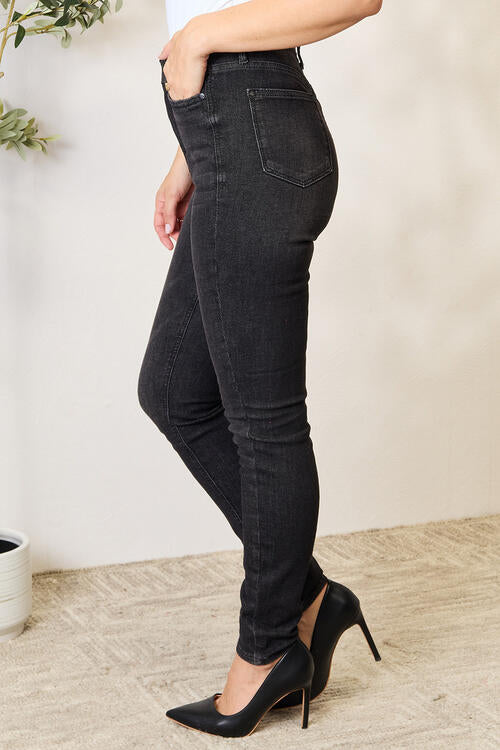 side view of model wearing judy blue black denim tummy control high waist denim