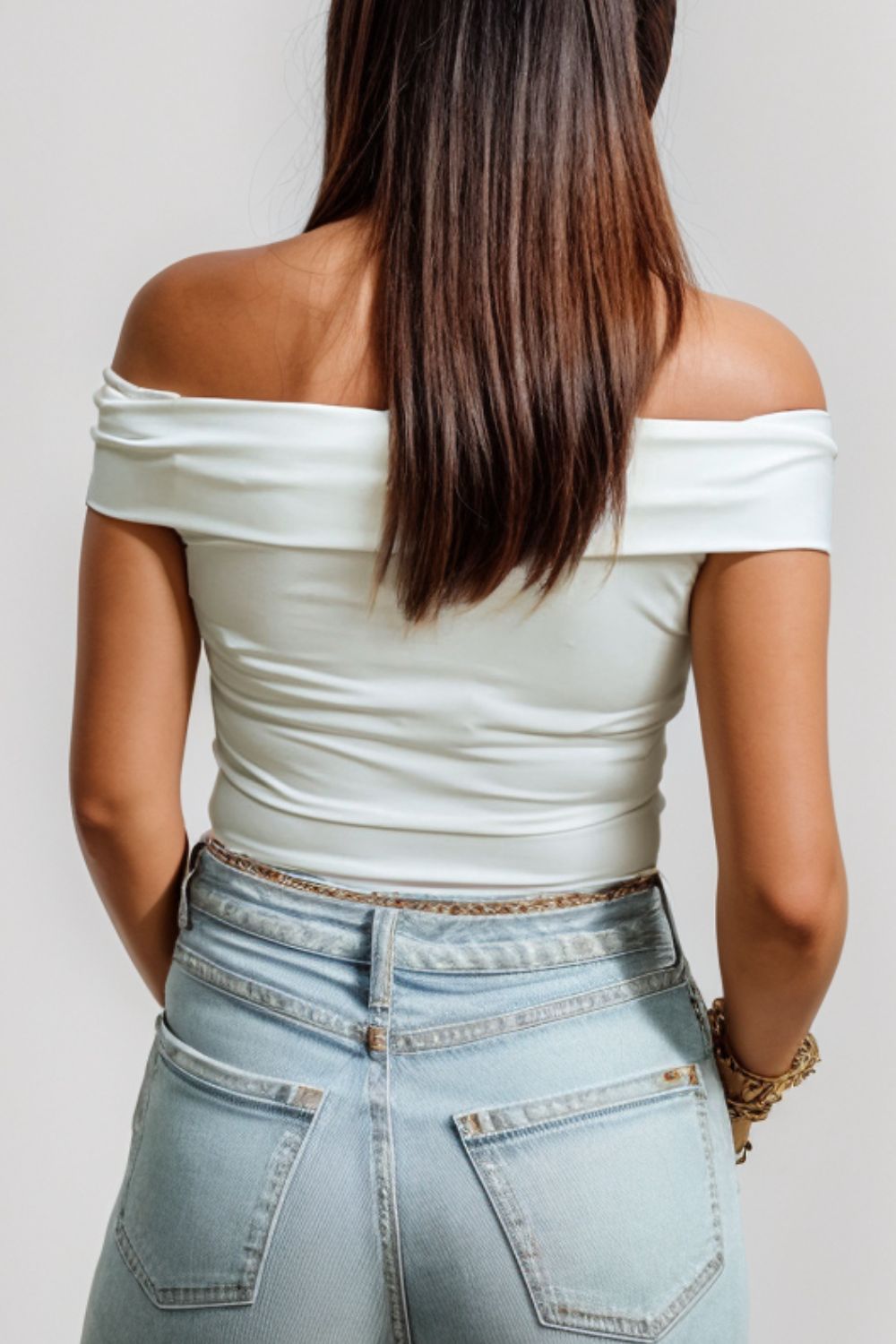Back view of Front view of off shoulder chic fashion blouse in white.