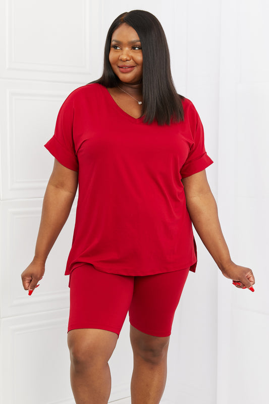 Model right facing view wearing plus size burgundy two piece lounge short set.