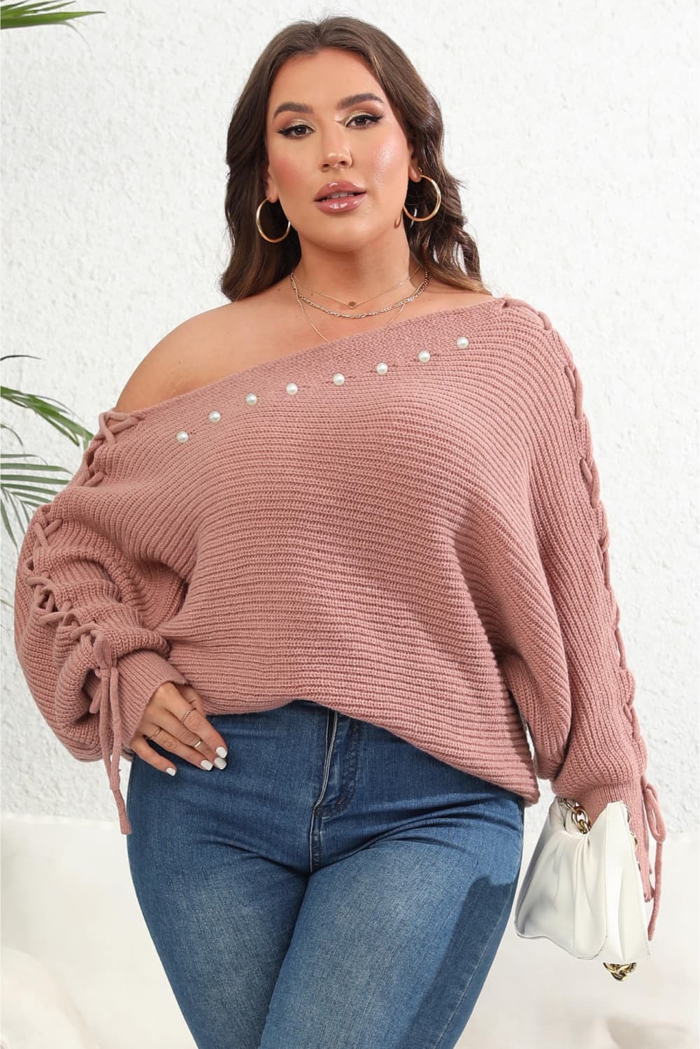 Model front view wearing Plus Size One Shoulder Beaded Sweater in the color dusty pink