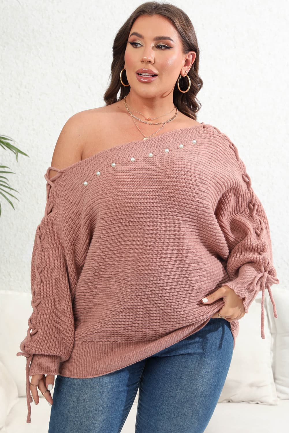 Model front view wearing Plus Size One Shoulder Beaded Sweater in the color dusty pink
