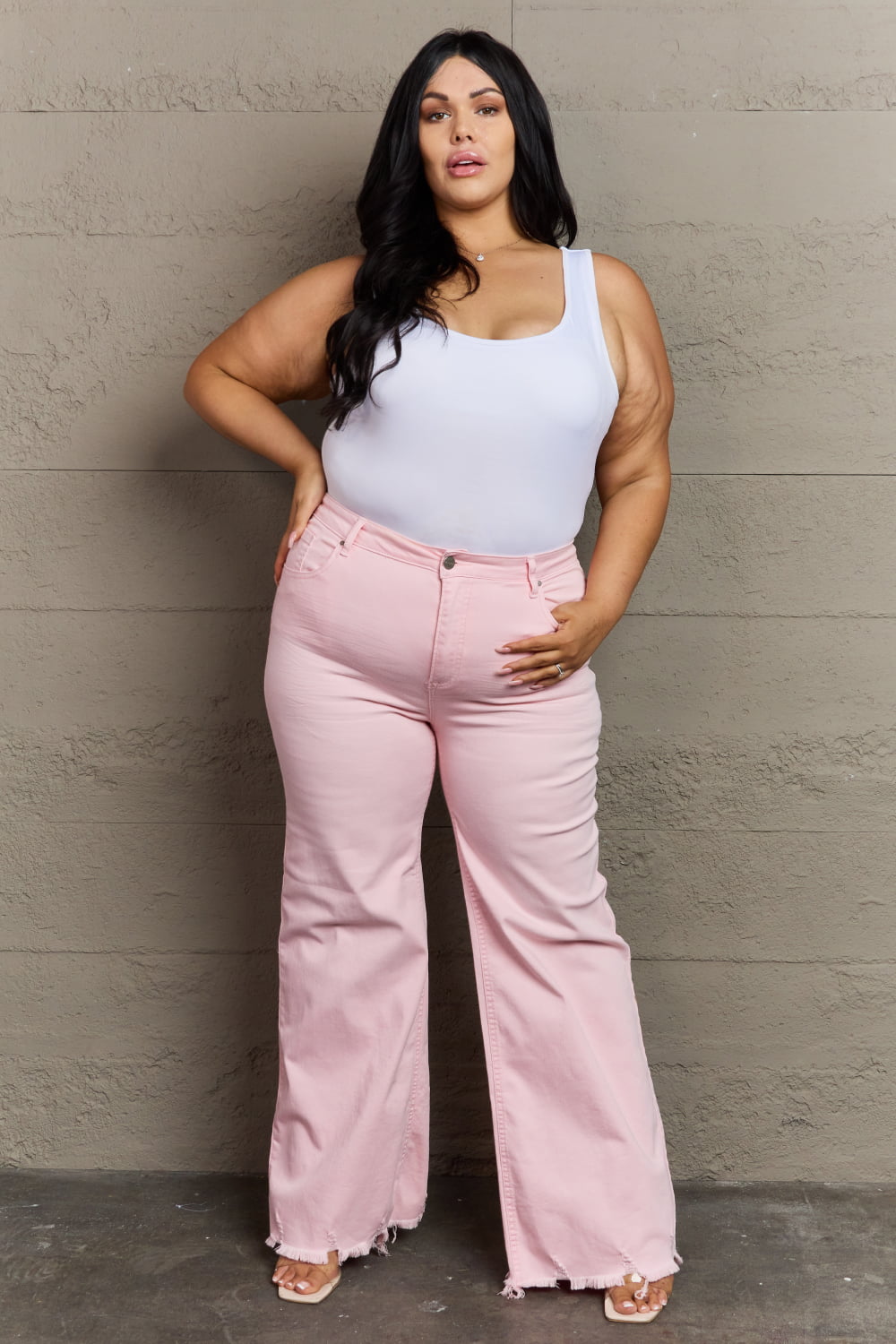 Front view of plus size RISEN Raelene Full Size High Waist Wide Leg Jeans in Light Pink 