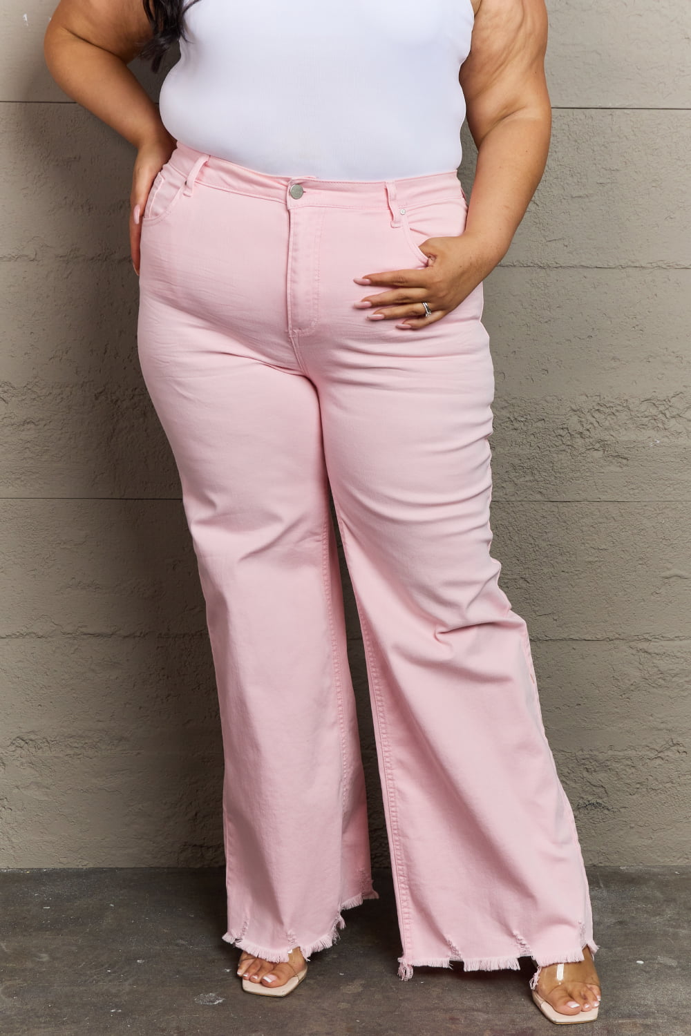 Front view of model wearing Plus Size  RISEN Raelene Full Size High Waist Wide Leg Jeans in Light Pink