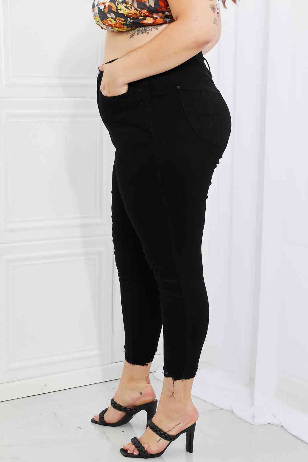 Side view of Plus Size Judy Blue Mila High Waisted Shark Bite Hem Skinny Jeans in black