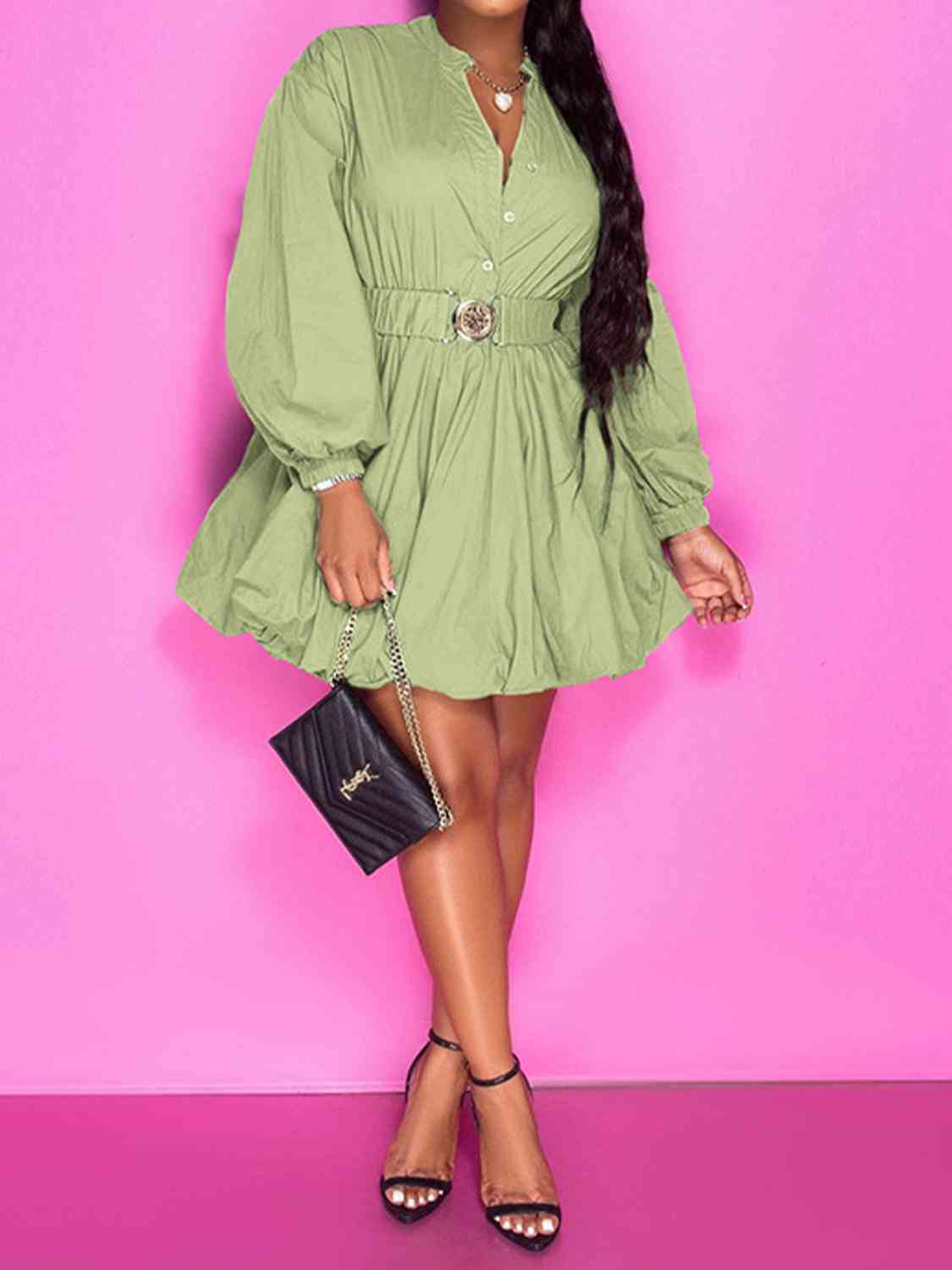 Front view of model wearing notched button up ballon sleeve dress in sage 