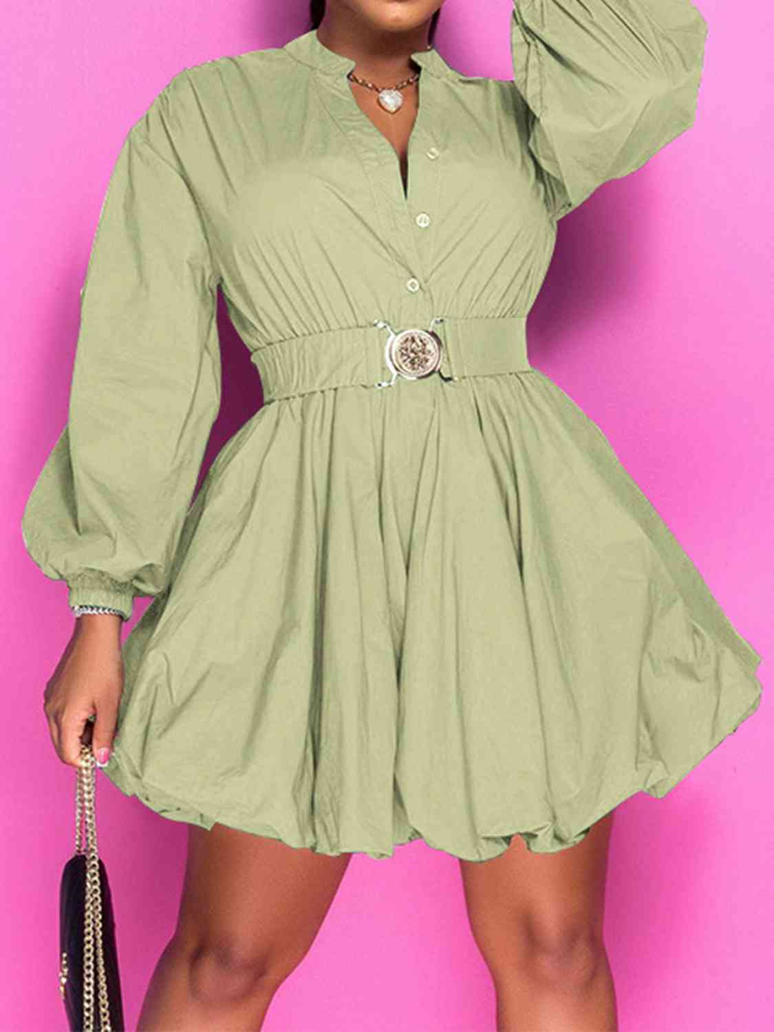 Front view of model wearing notched button up balloon sleeve dress sage