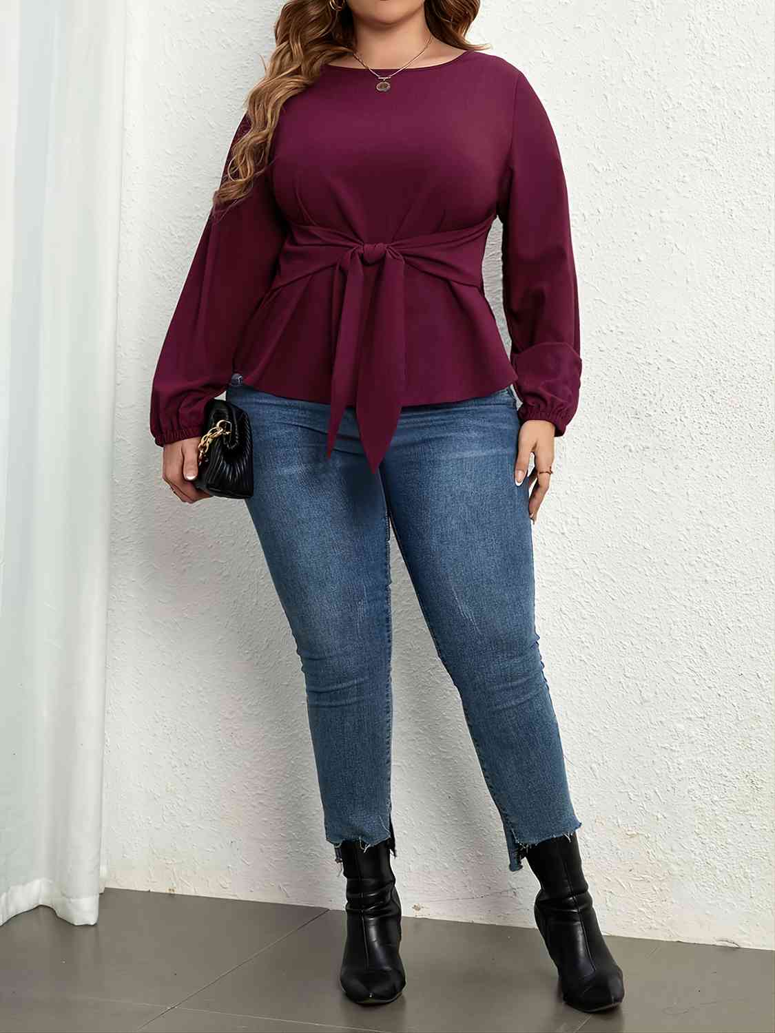 Model wearing Plus Size Tie Front Long Sleeve Blouse - Right side full body view